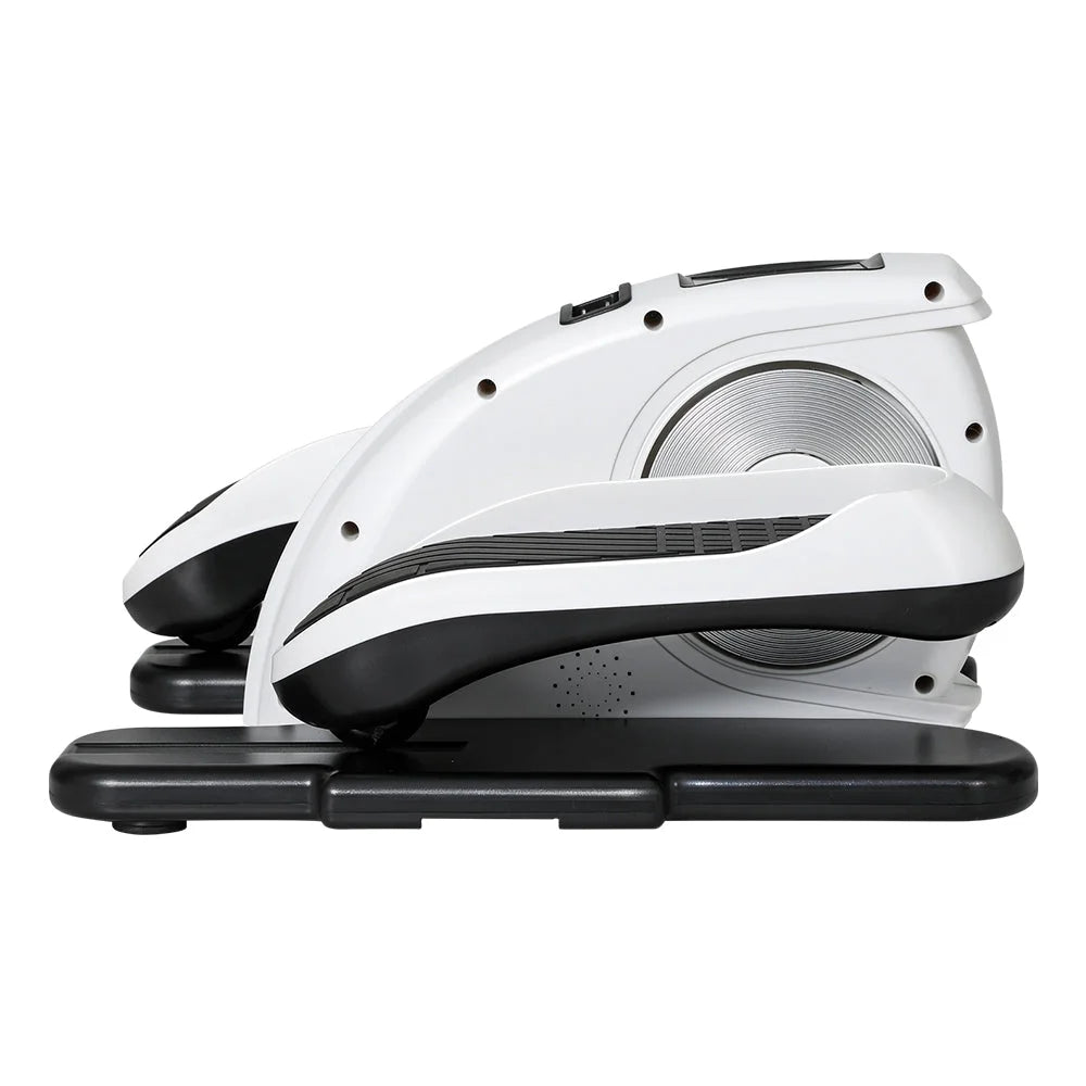 Exercise bike with black pedals and adjustable resistance knob