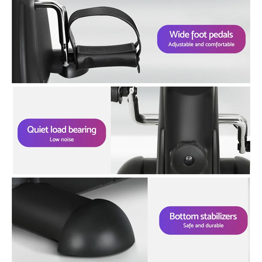 Black mini exercise bike with matching accessories and clear item layout