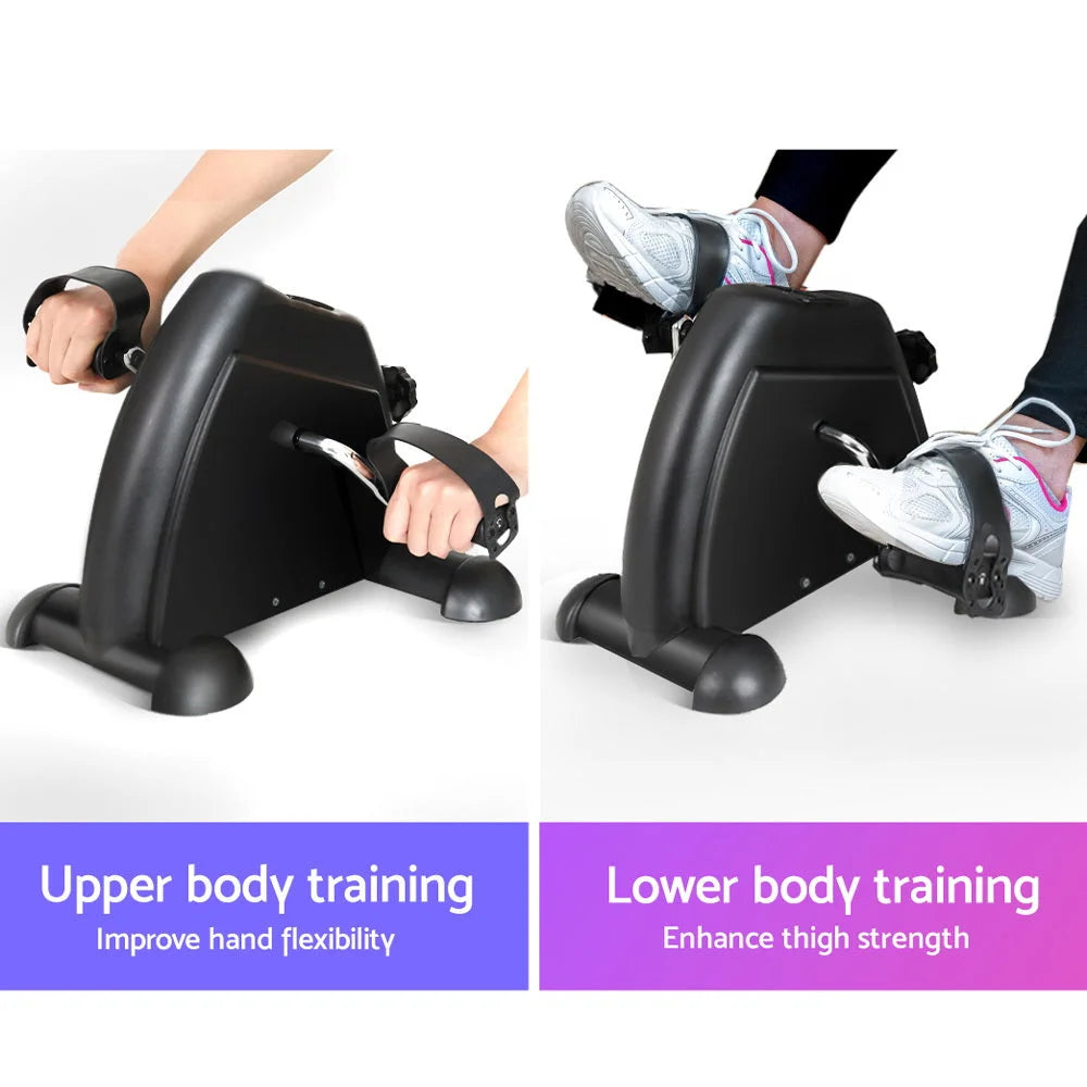 Black mini exercise bike with handles, panels and accessory pieces