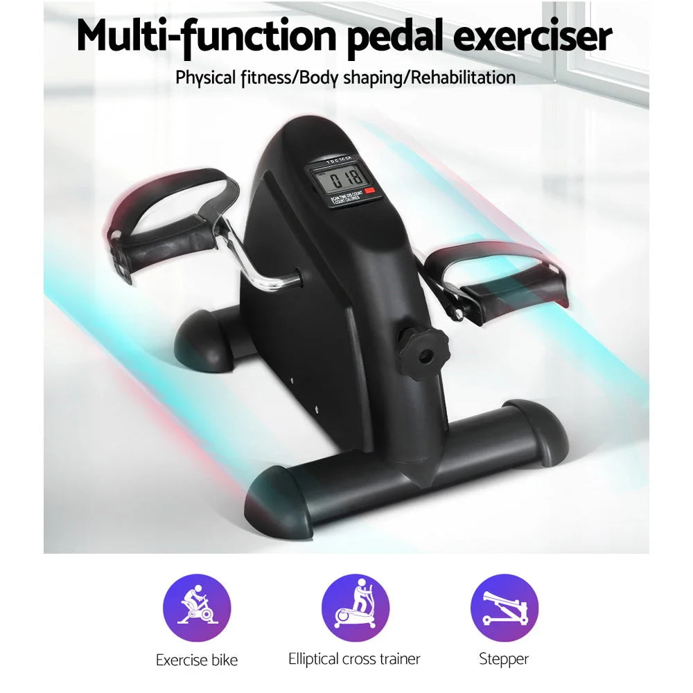 Black exercise bike with black pedals and adjustable resistance knob