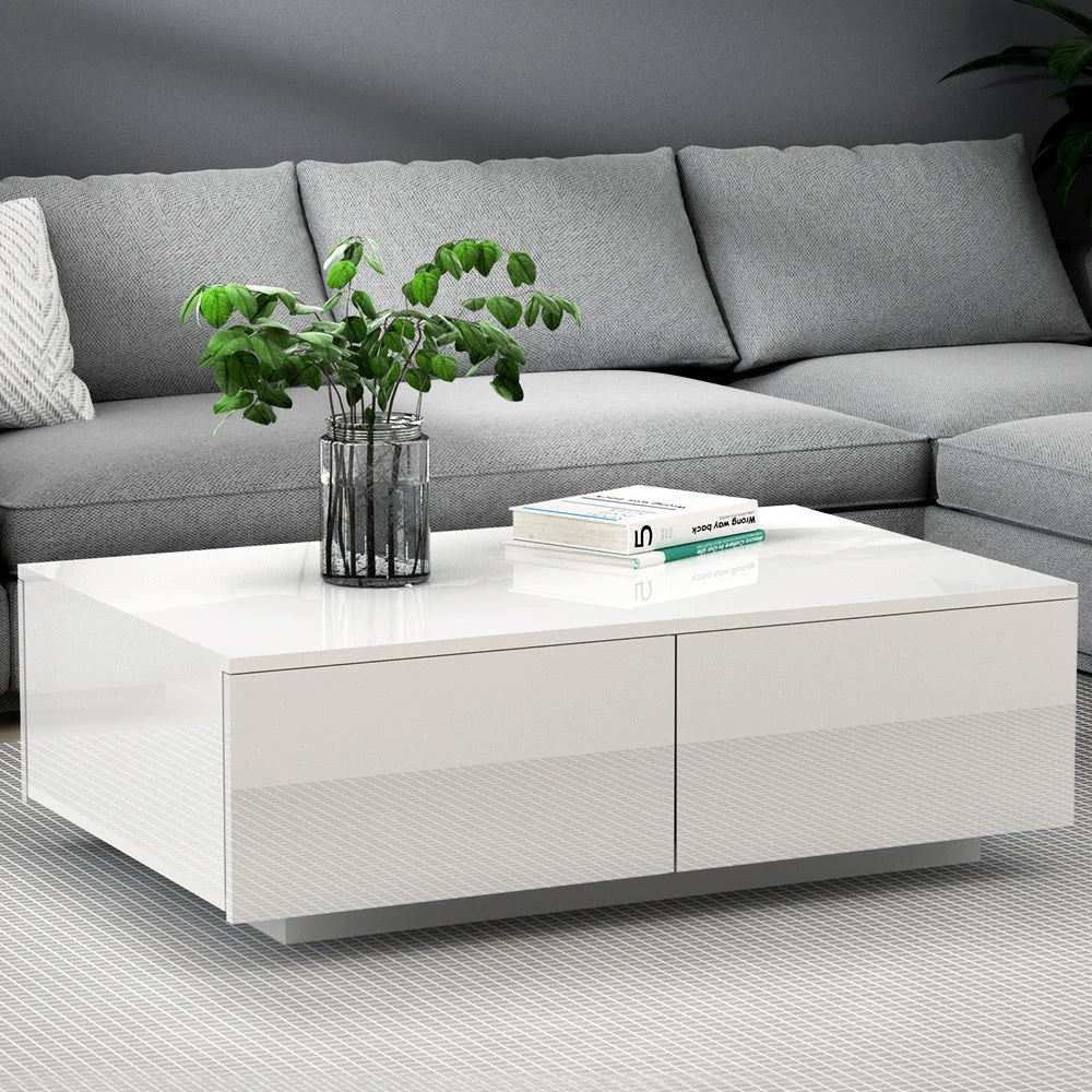 White coffee table with low tabletop and lower storage shelf