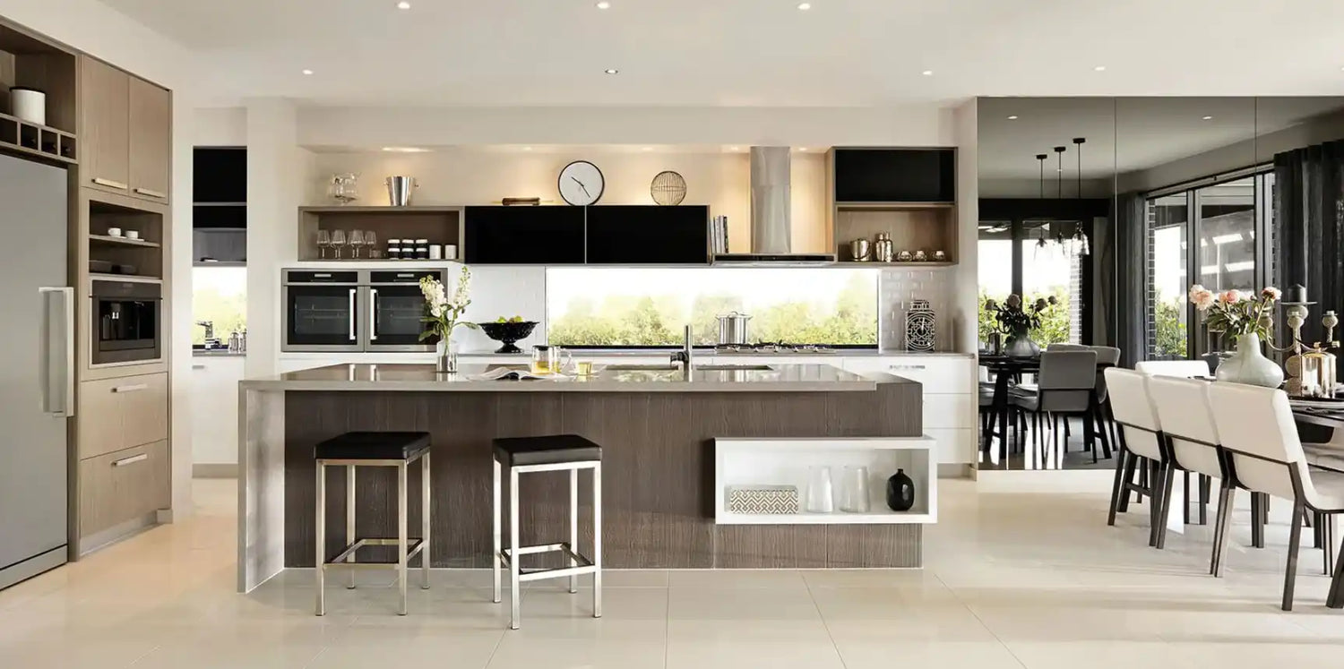 A modern open-concept kitchen with an island and integrated appliances.