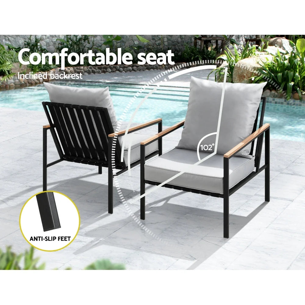 Table with outdoor bistro lounge chairs