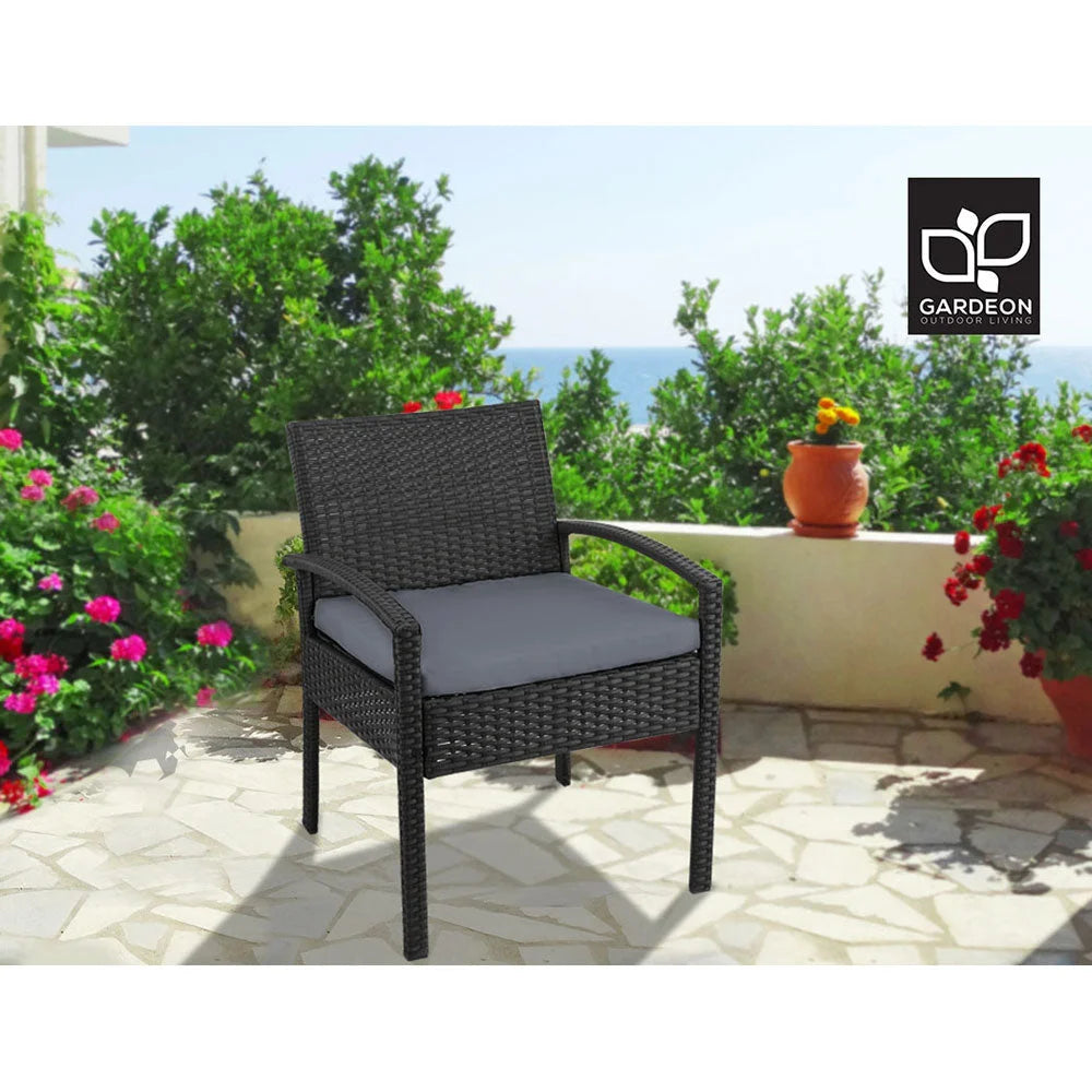 Black wicker outdoor bistro chair with armrests and tapered chair legs