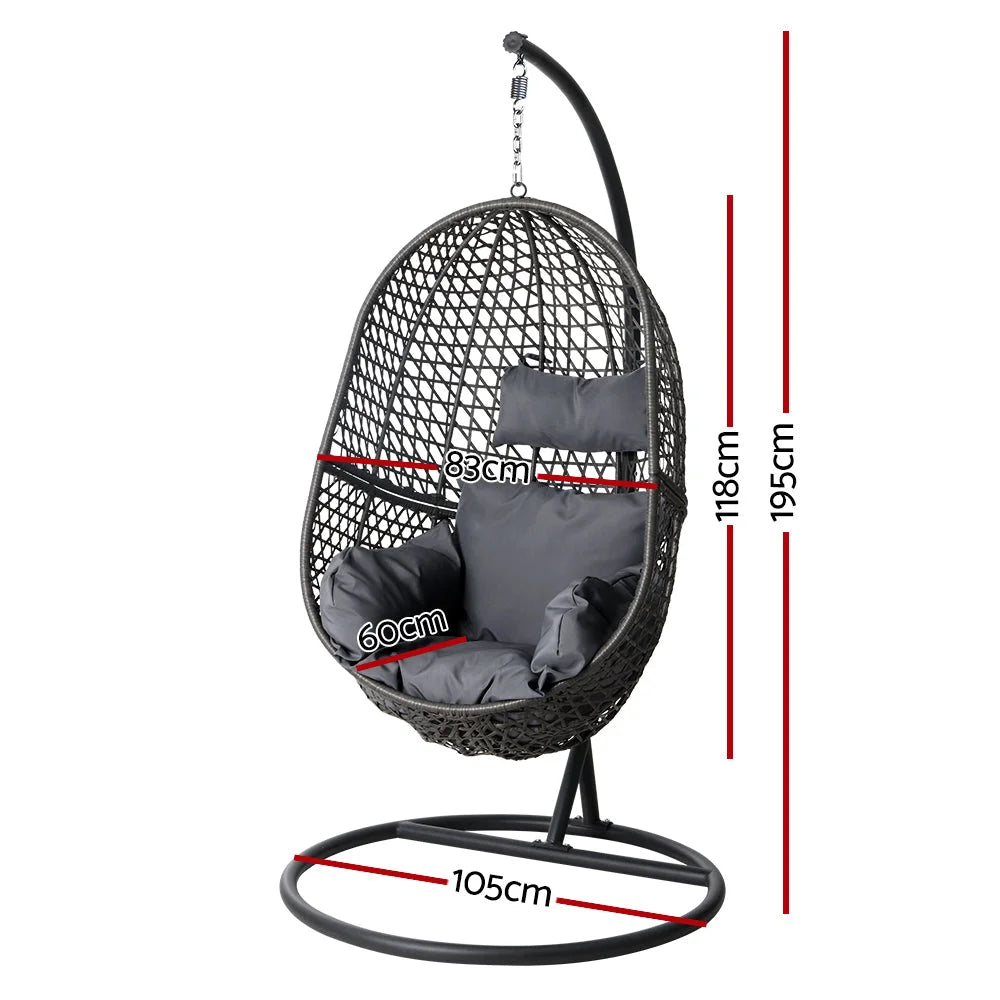 Black wicker swing chair with upholstered seat and curved back