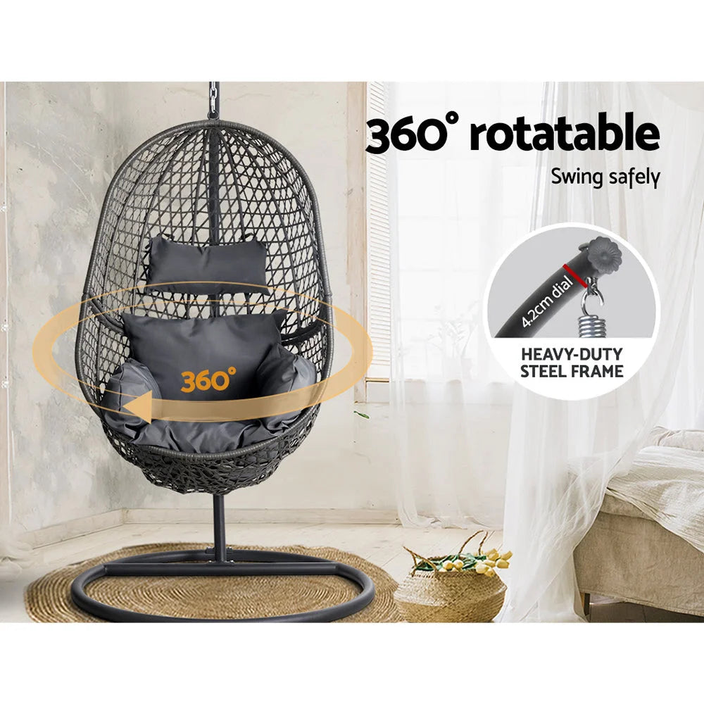 Black wicker swing chair with hanging seat and stand supports
