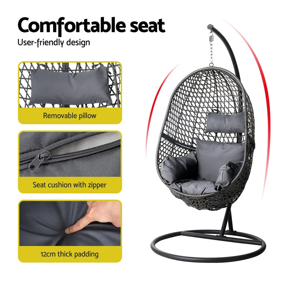 Black wicker swing chair with mesh backrest and caster base