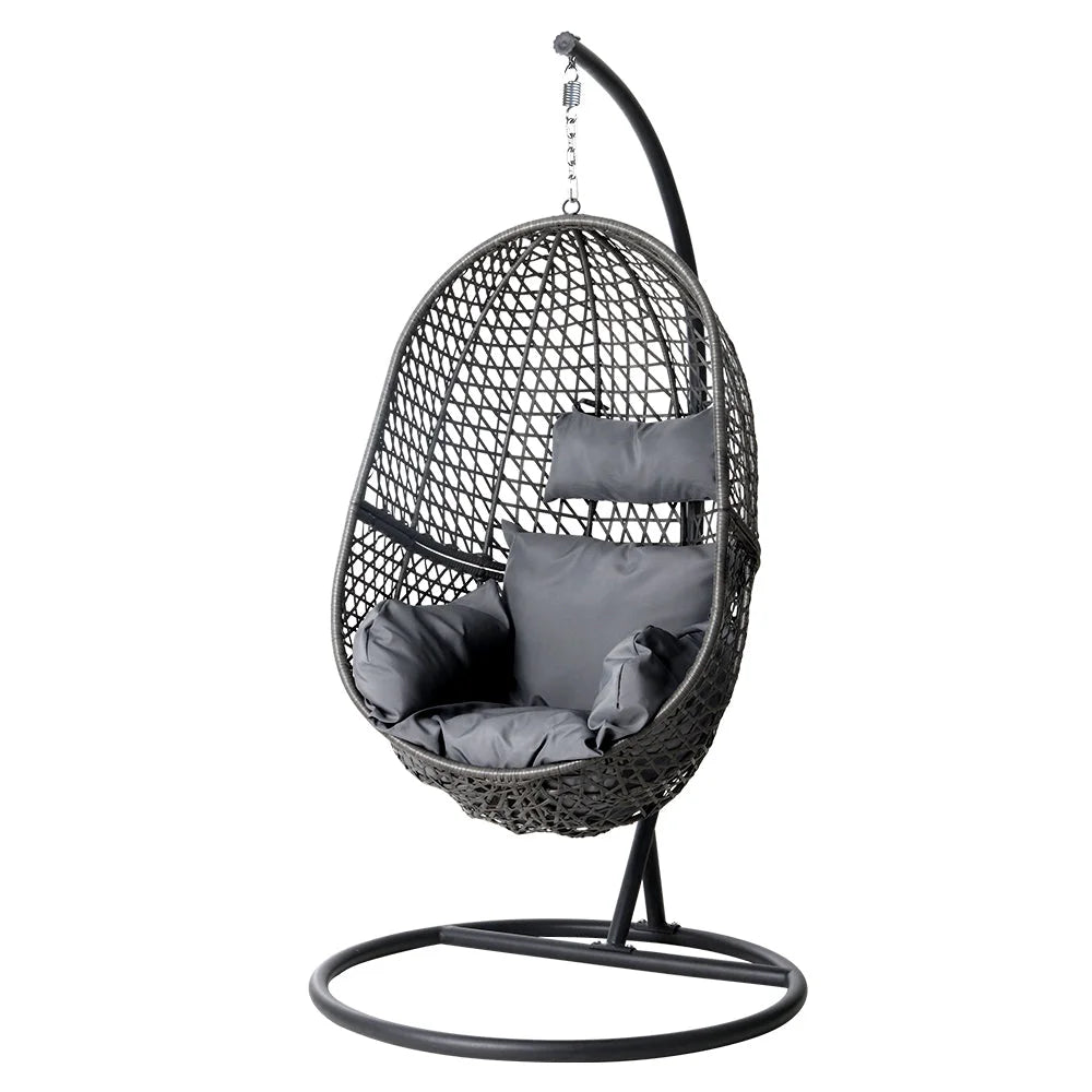 Black wicker swing chair with padded seat and support frame
