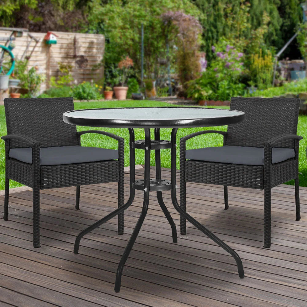 Black wicker outdoor sofa set with armchairs and outdoor table arrangement