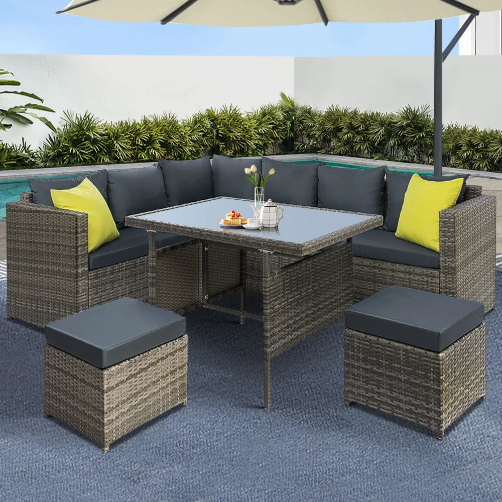 Grey wicker outdoor sofa set with woven seating and matching table