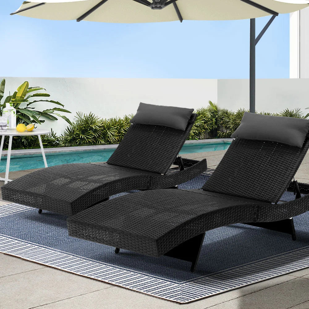 Black wicker outdoor sun lounge with outdoor lounger frame and angled backrest