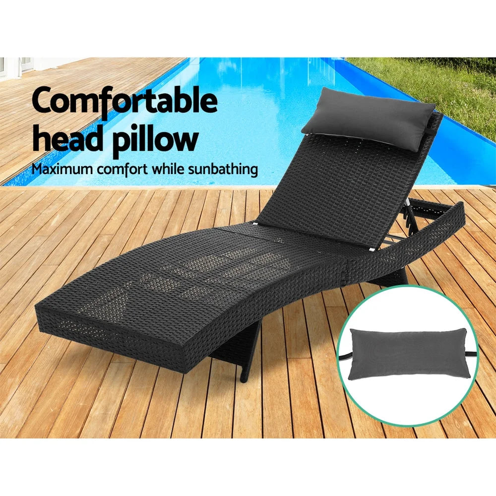 Black wicker outdoor sun lounge with folding lounger seat and slatted footrest
