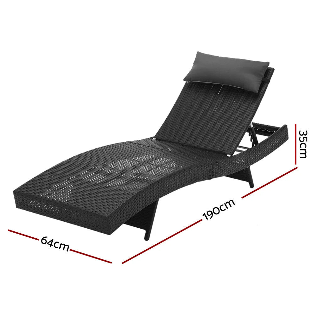 Black wicker outdoor sun lounge with reclining wooden chair and small side table