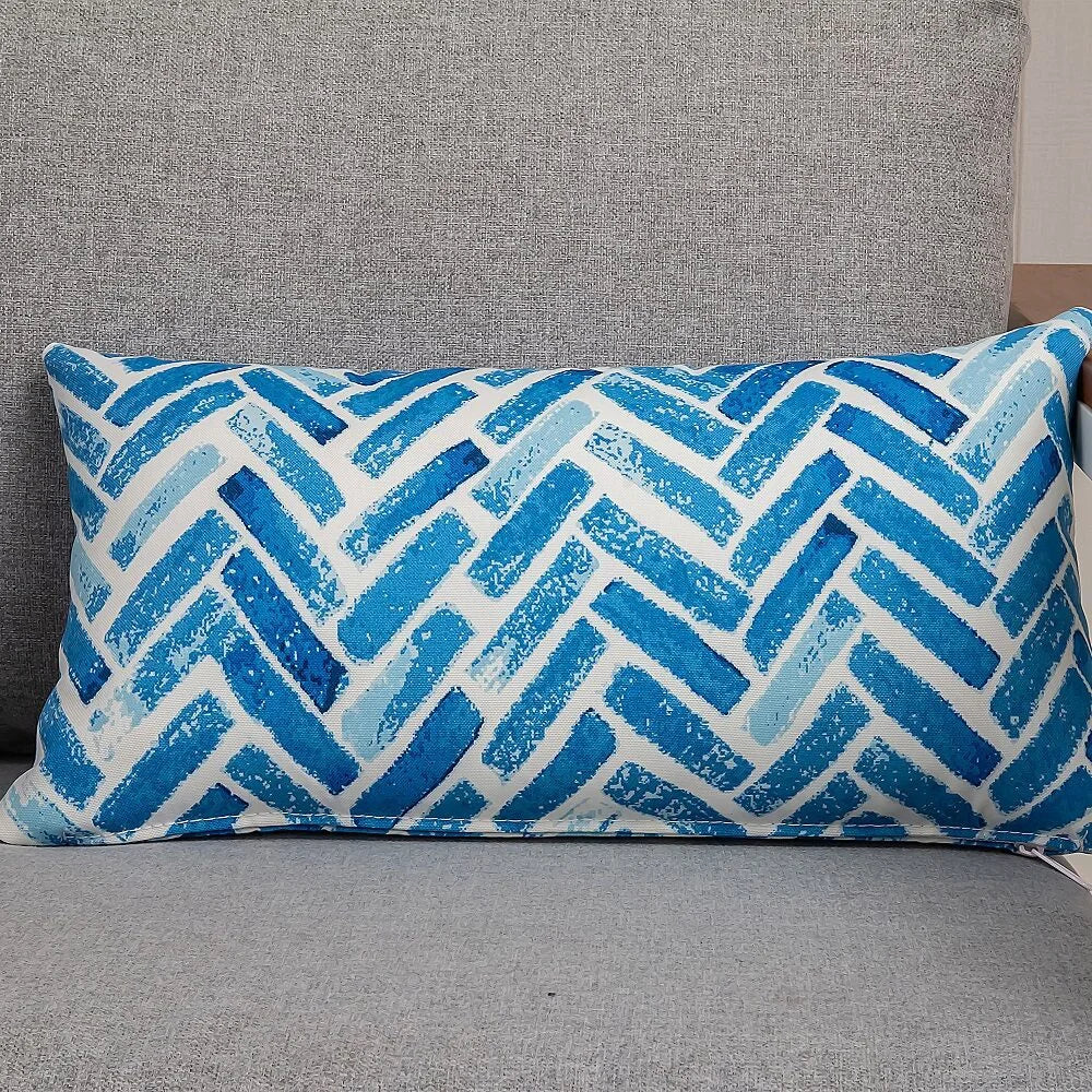 Rectangular outdoor cushion with matching accessories and clear item layout