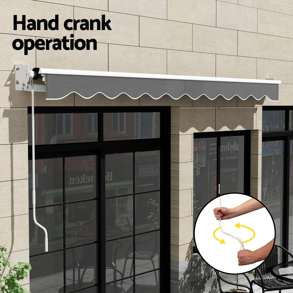 Grey 5m retractable awning with striped awning fabric and folding arm frame