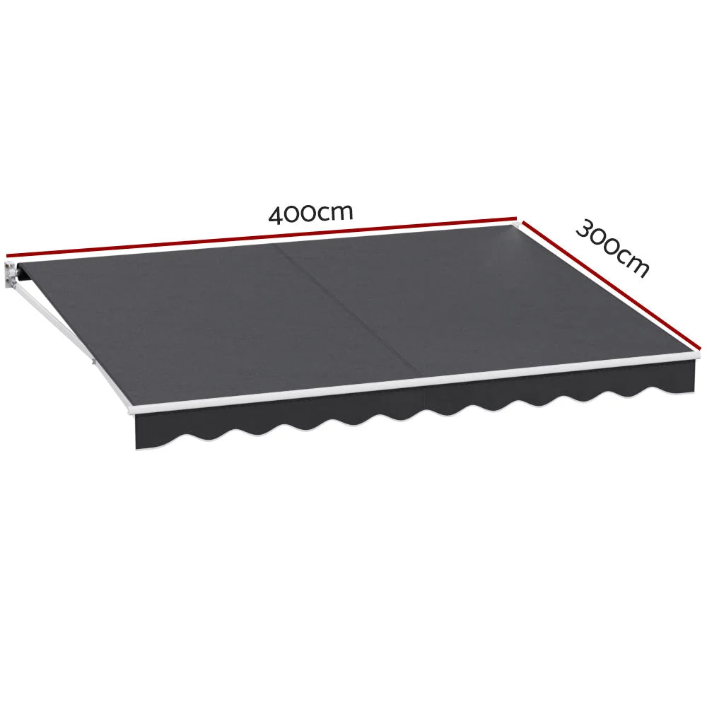 Retractable awning with grey canopy fabric and articulated arms