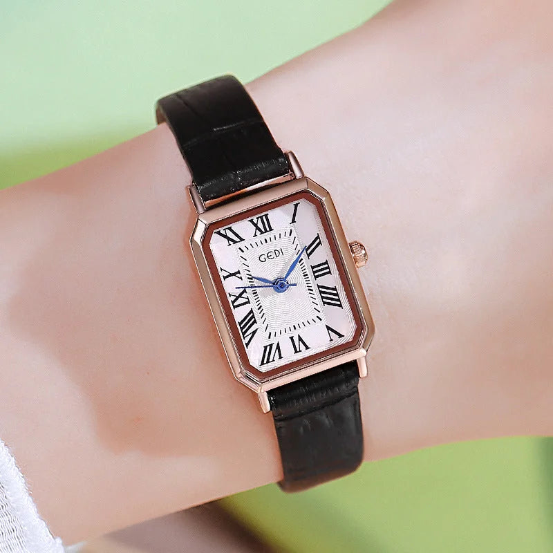Rose gold case white dial and black belt Ladies Quartz