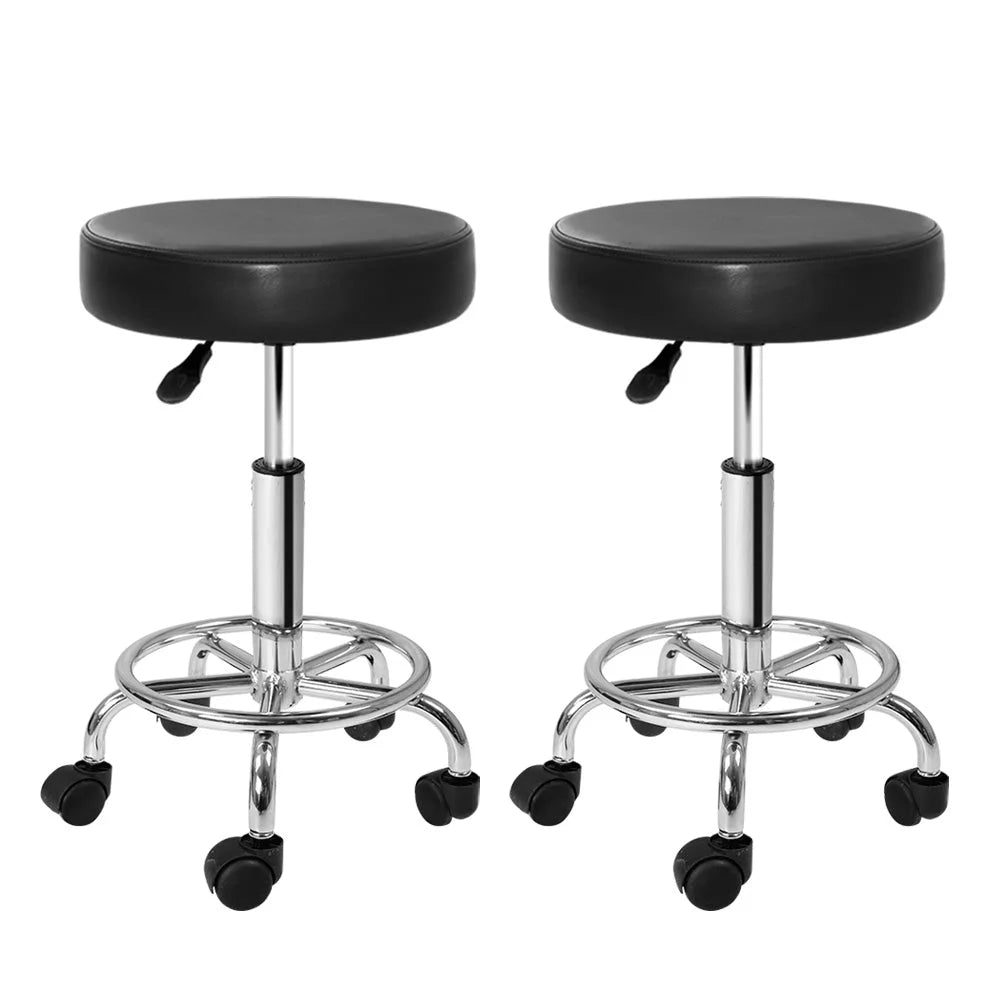 Set of two black hydraulic swivel salon stools