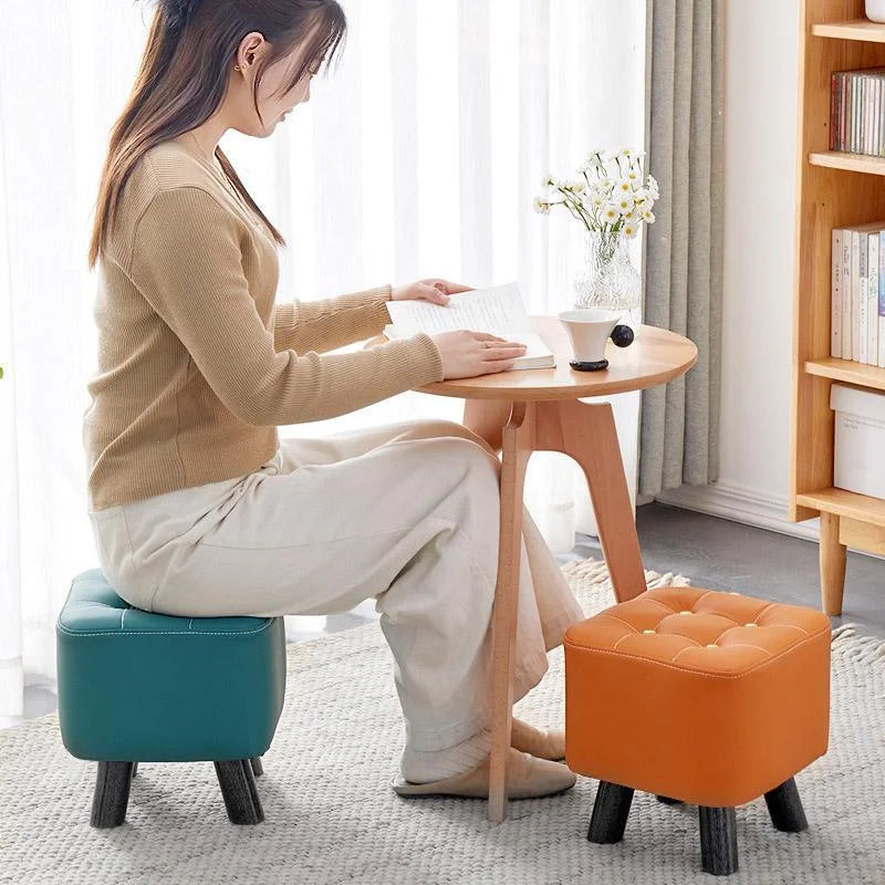 Small stool sofa with matching accessories and clear item layout
