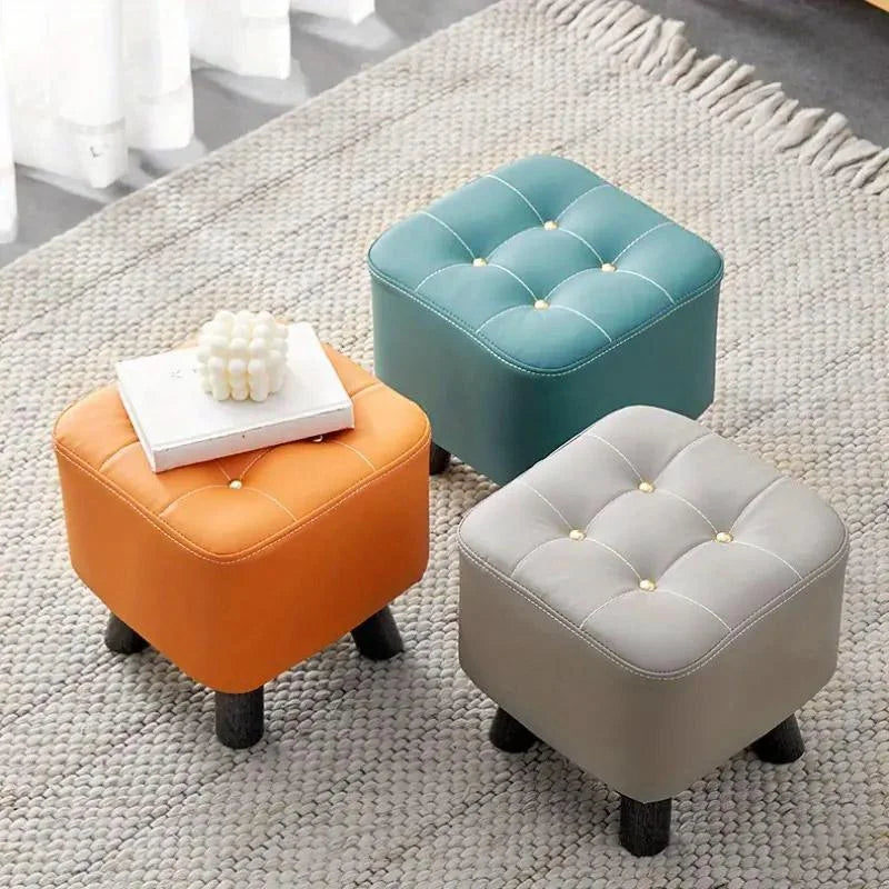 Orange small stool sofa with storage shelves and support legs
