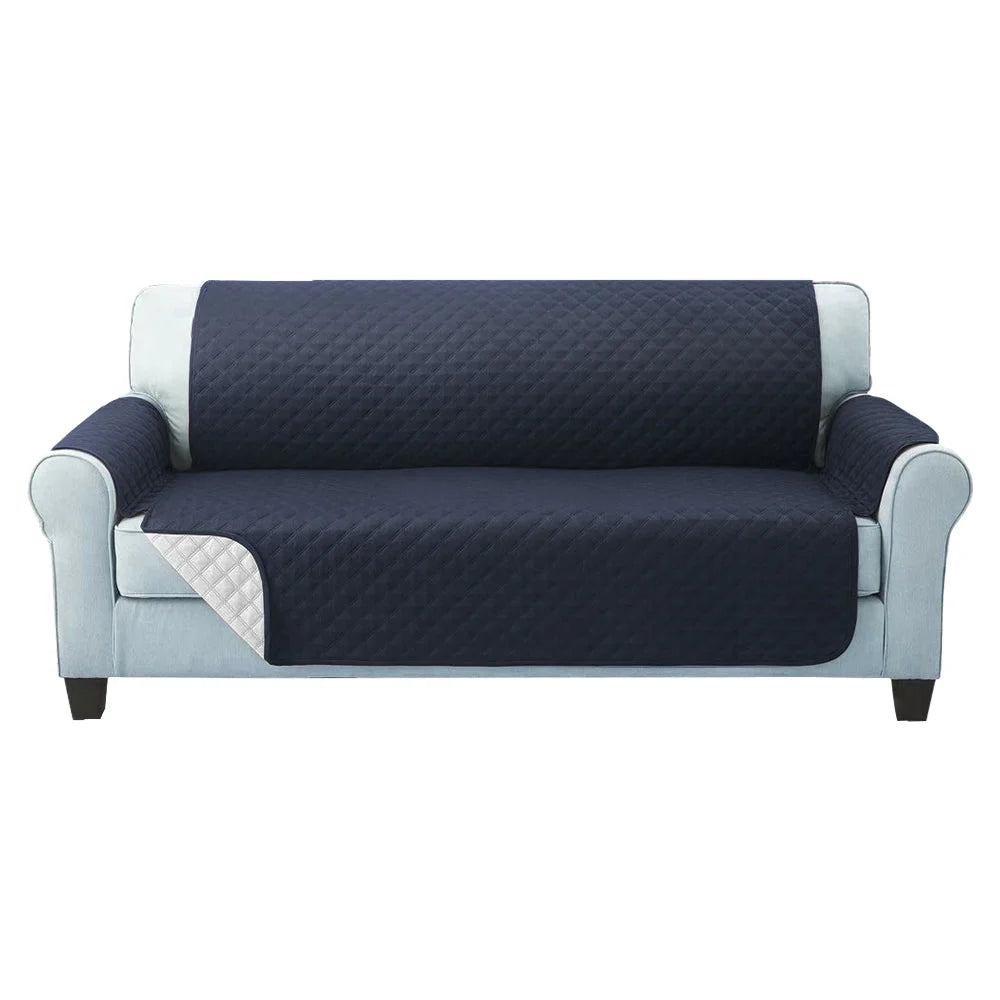 Grey sofa cover quilted with caster wheels and side handle rail