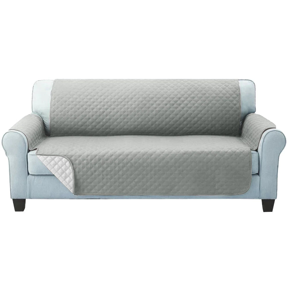 Sofa cover quilted with matching accessories and clear item layout