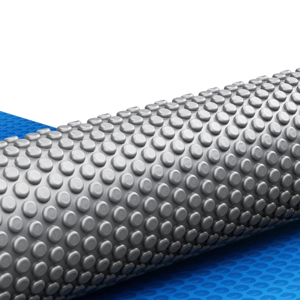 Blue 11x6 swimming pool cover with blue bubble blanket roll shape
