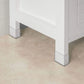 Tall cabinet standing with slim storage layout and glass door