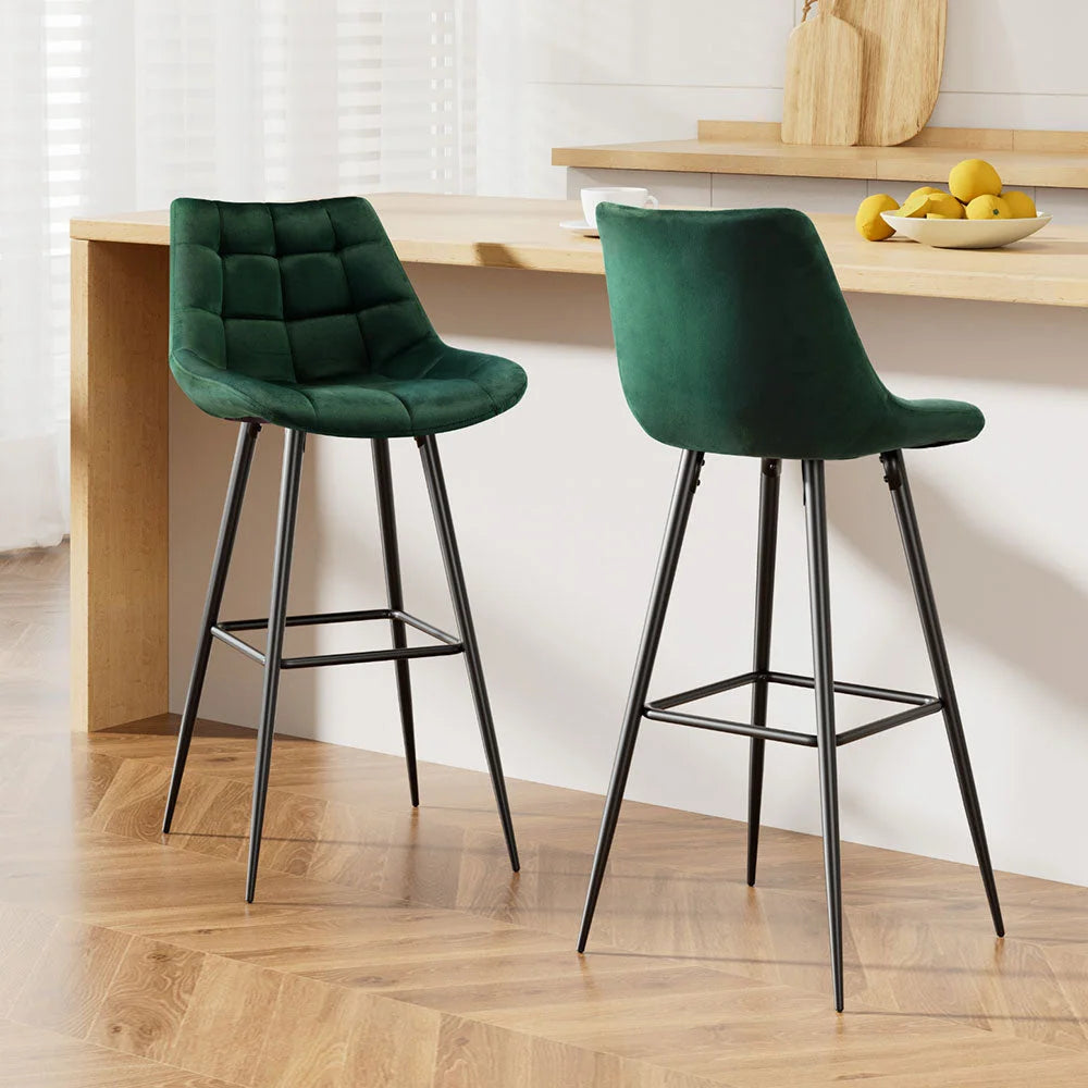 Green velvet bar stool set with shaped seat and supportive backrest