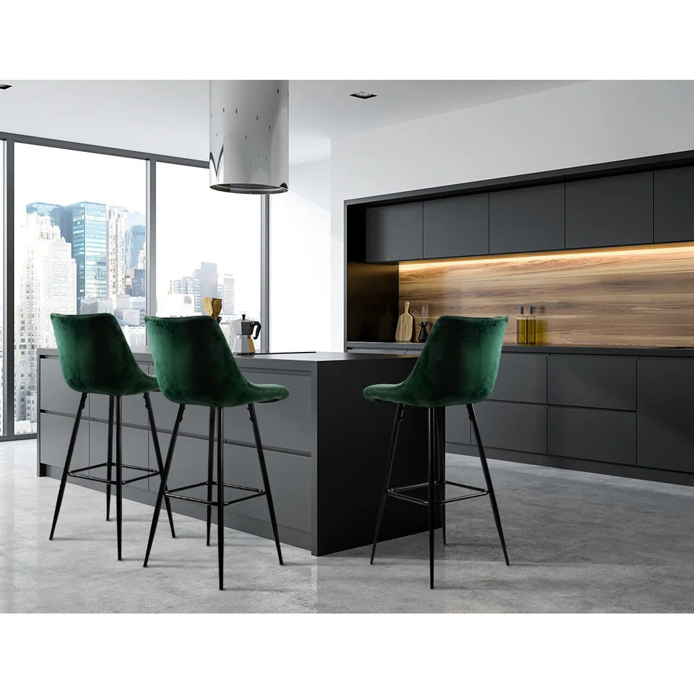Green velvet bar stool set with seat padding and sturdy legs