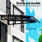 Grey metal window door awning with grey awning sheet and mounting frame