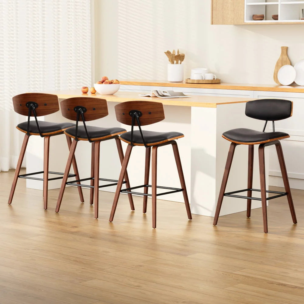 Set of four black wooden dining chairs